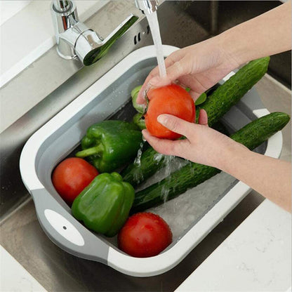 Cutting board with integrated dish tub basket