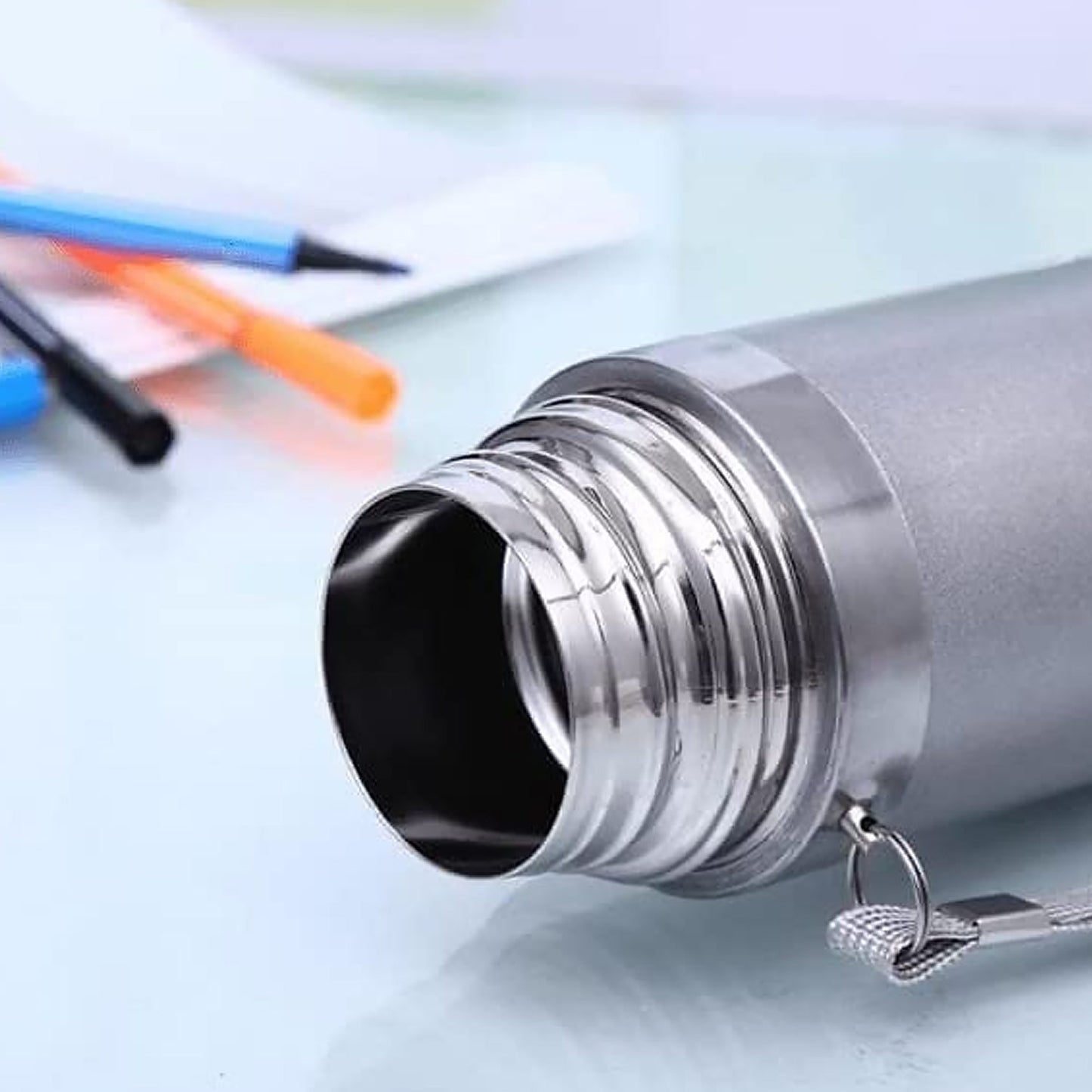 Stainless steel vacuum bottle with secure cap