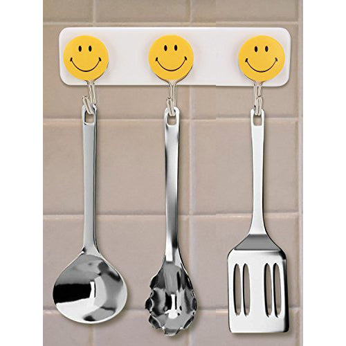 Pack of 3 self-adhesive smiley hooks for home use.