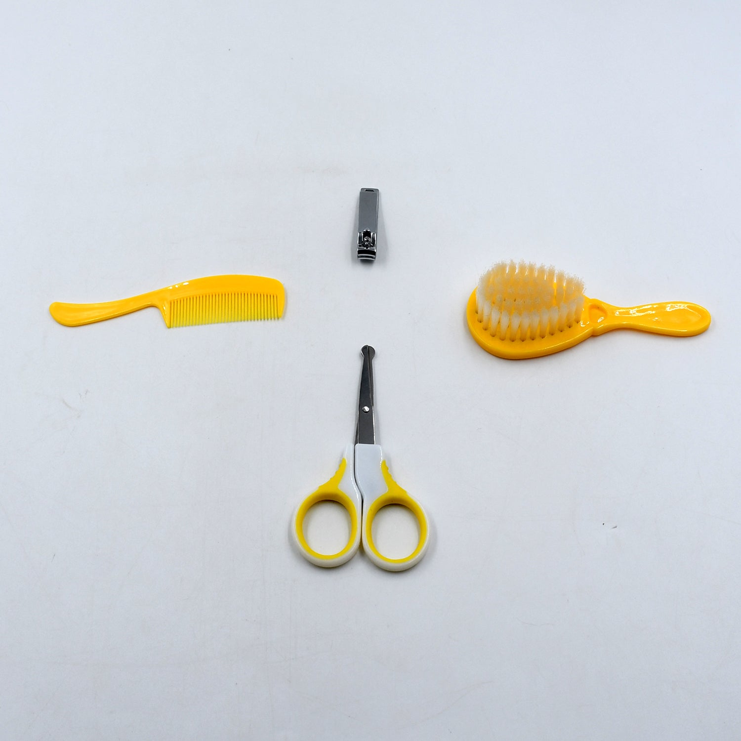 Complete baby care kit with nail clipper, comb, brush, and scissors for safety and grooming.