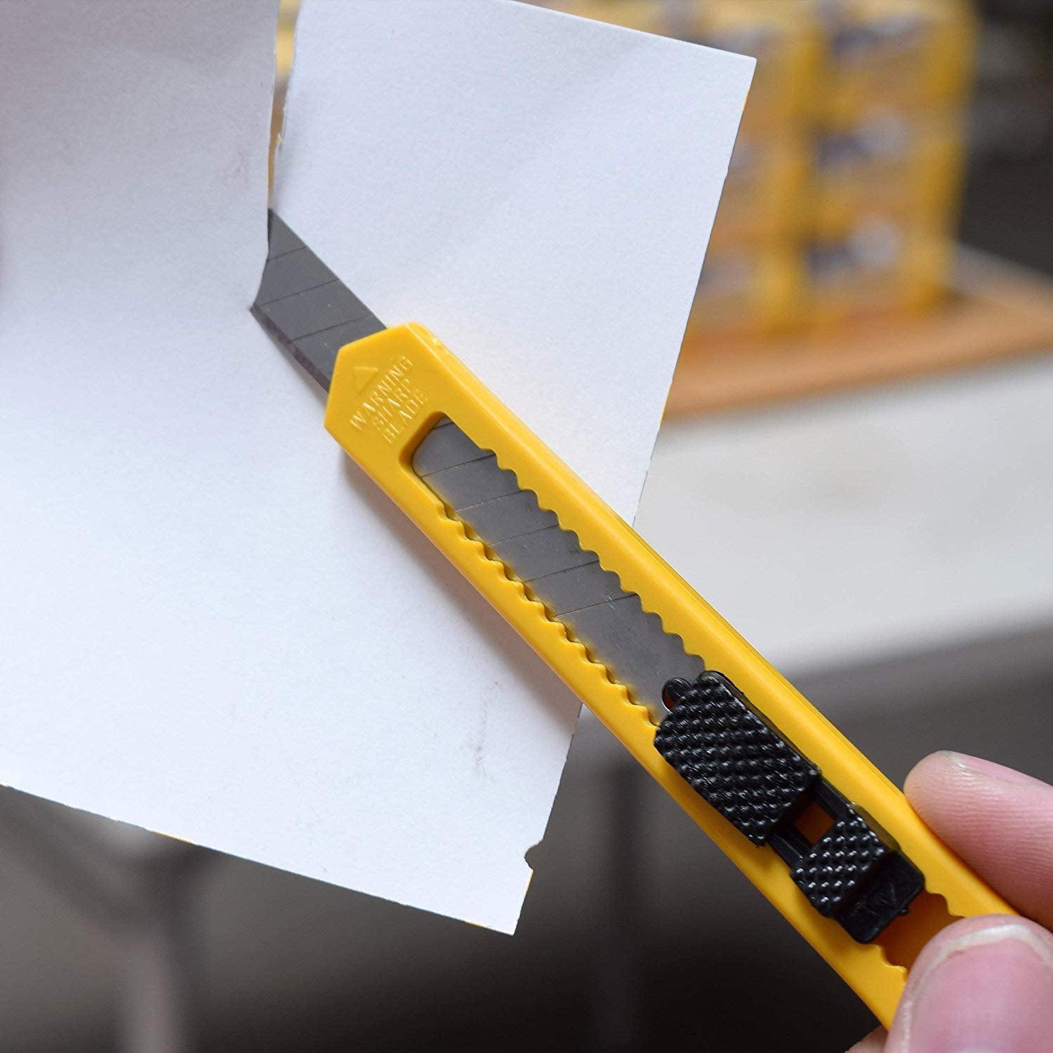 Paper cutter with safety guard