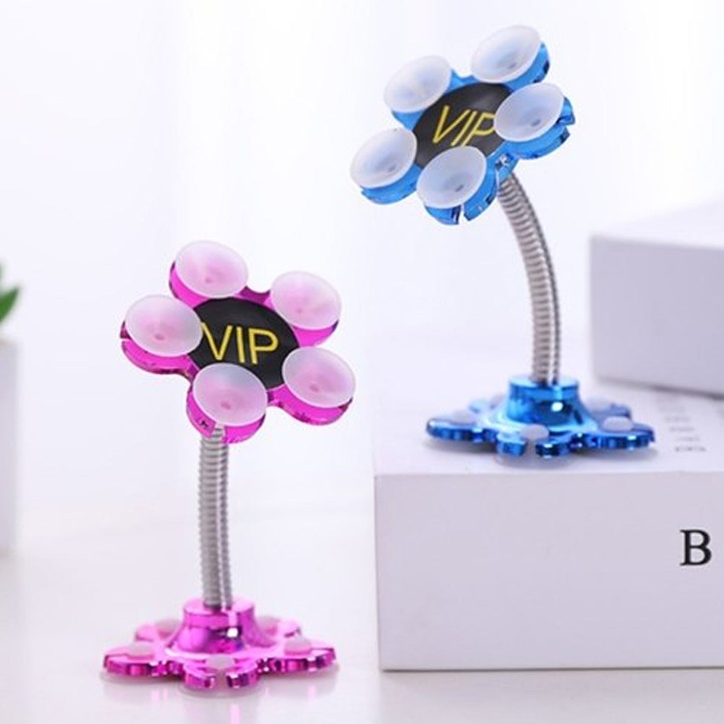 VIP phone stand with rotatable feature and suction cups.