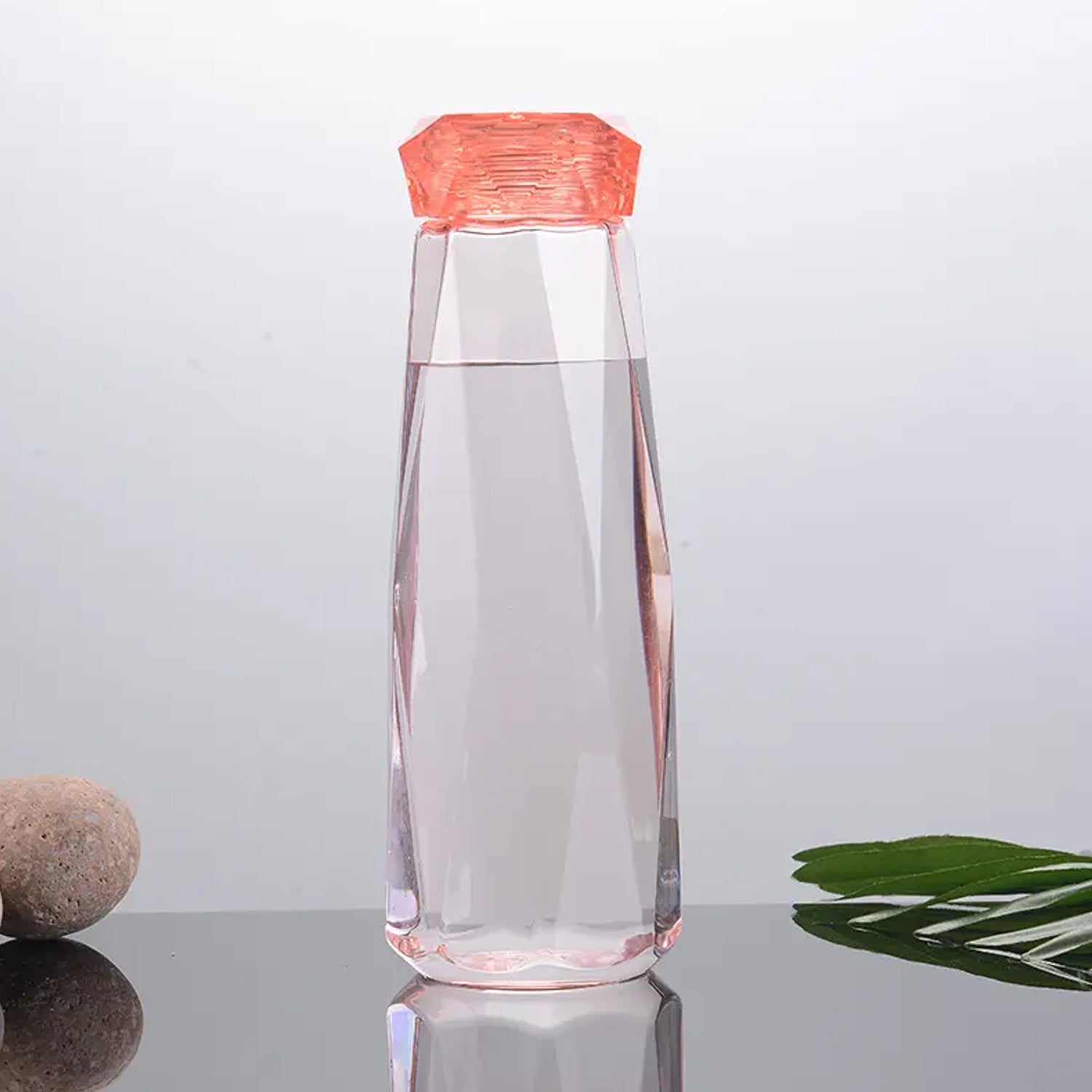 Glass water bottle with plastic cap