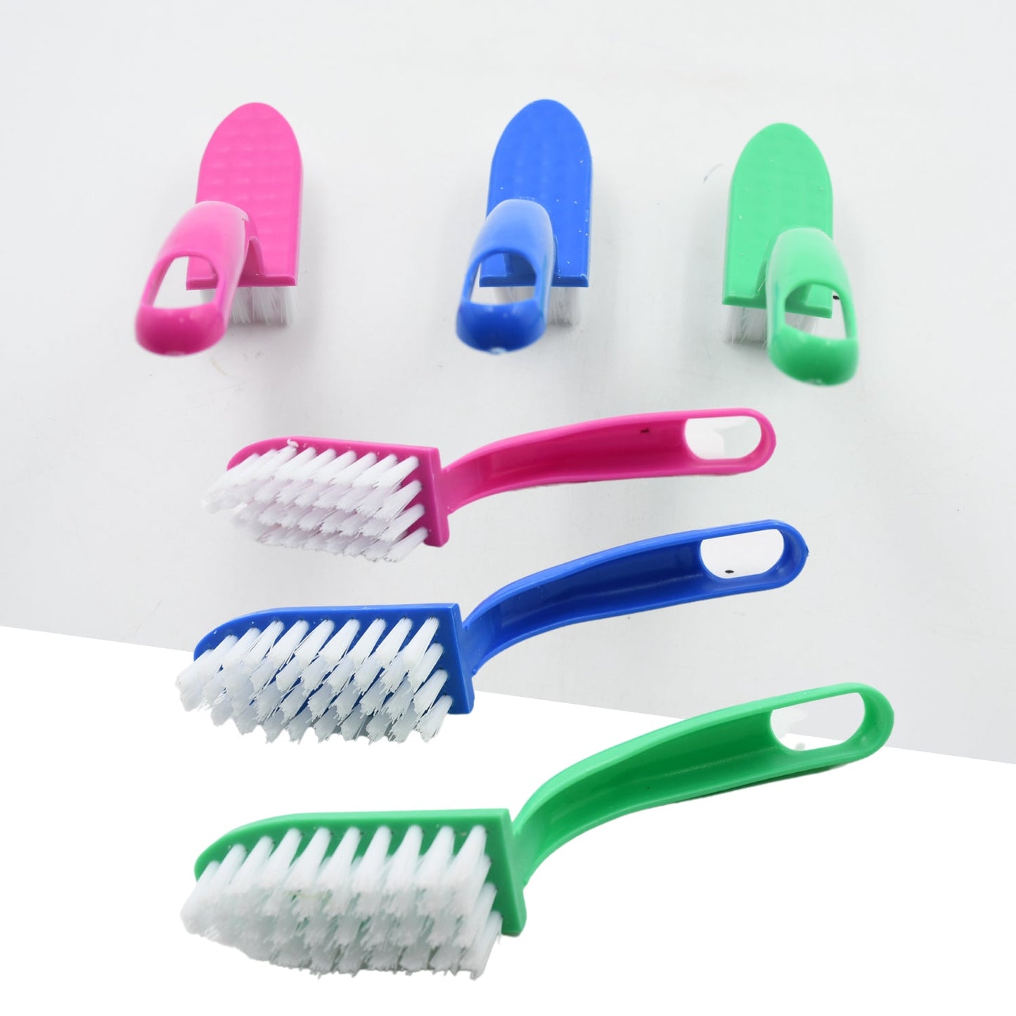 Multi-use cleaning brushes for kitchen tasks, including fish and vegetable cleaning.