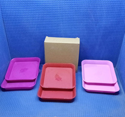 Various colors of square plastic plates.