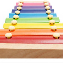 Wooden xylophone with colorful bars and mallet, suitable for children