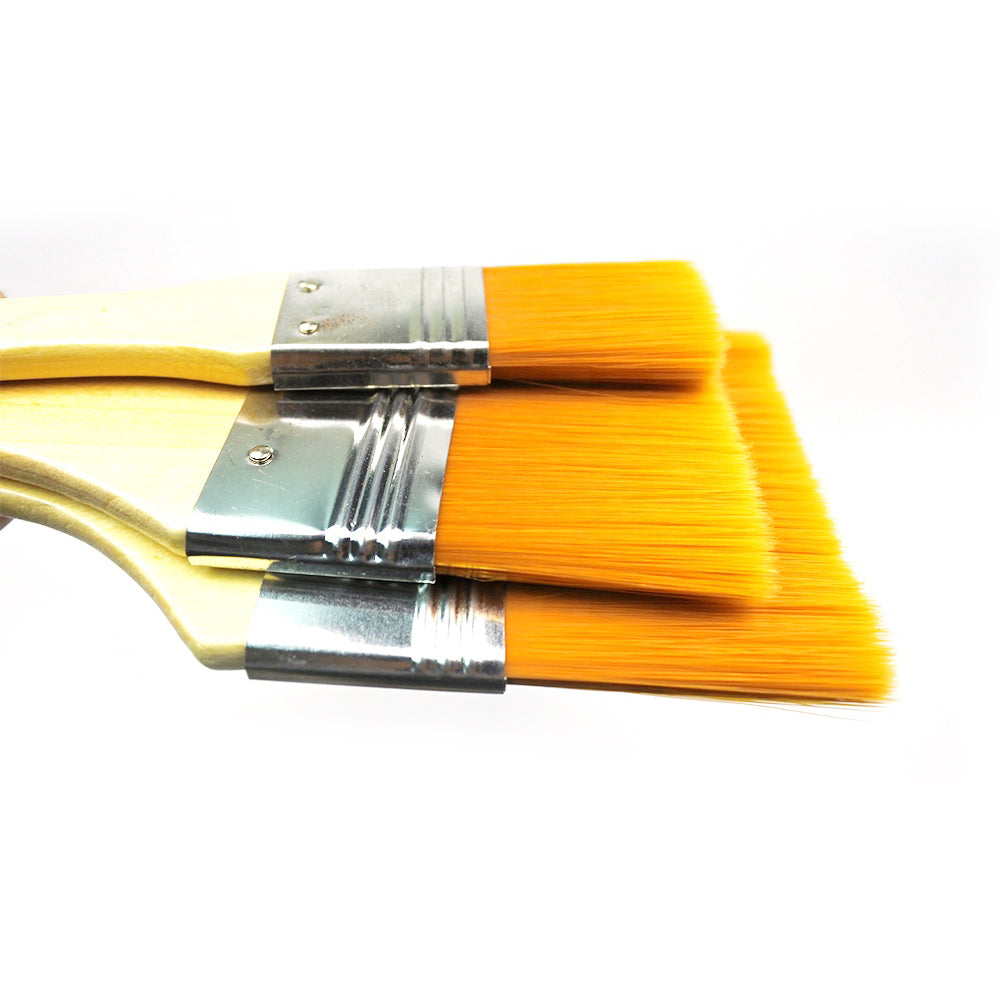 Flat painting brushes with ergonomic handles.