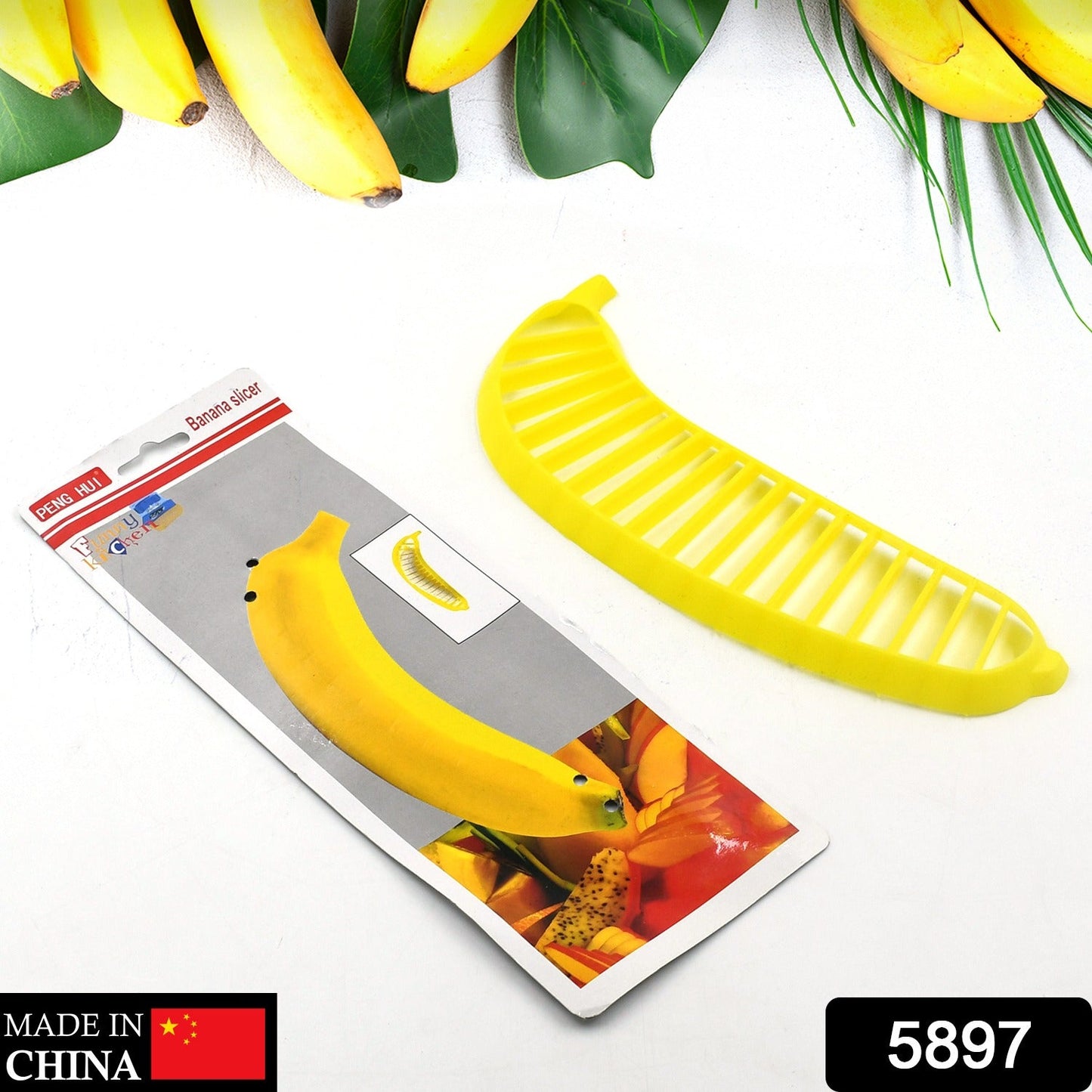 Banana slicer cutter, plastic, with handle for slicing fruit for salads.